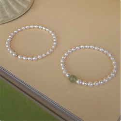 Natural Fresh Water Pearl Stretch Bracelet with Single Light Green Jade Bead or Gold Bead