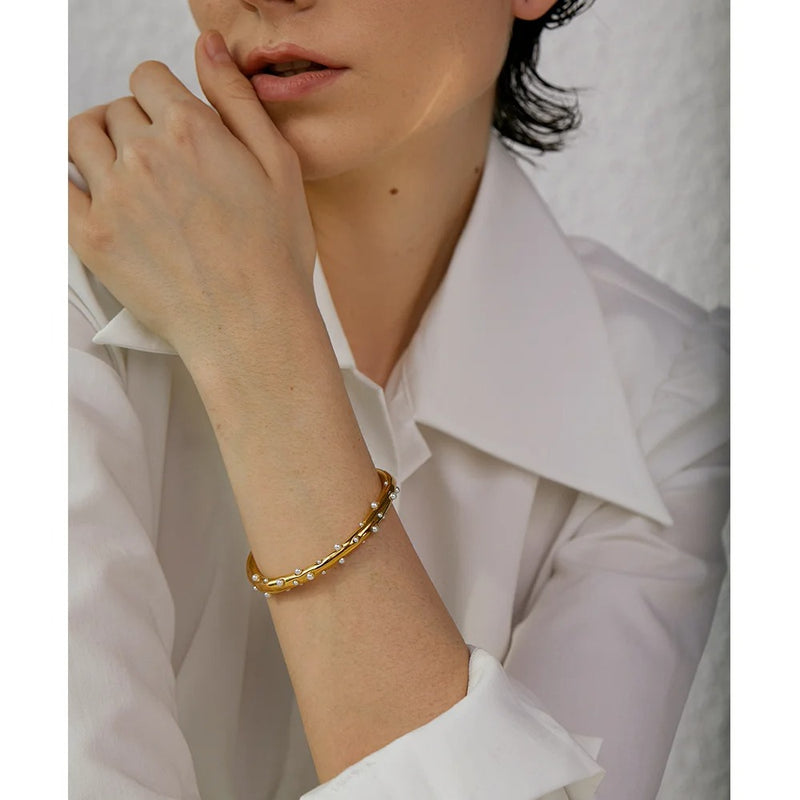 Gold-Toned Stainless Steel Open Cuff Bracelet Adorned with Sophisticated Faux Pearls