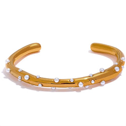 Gold-Toned Stainless Steel Open Cuff Bracelet Adorned with Sophisticated Faux Pearls